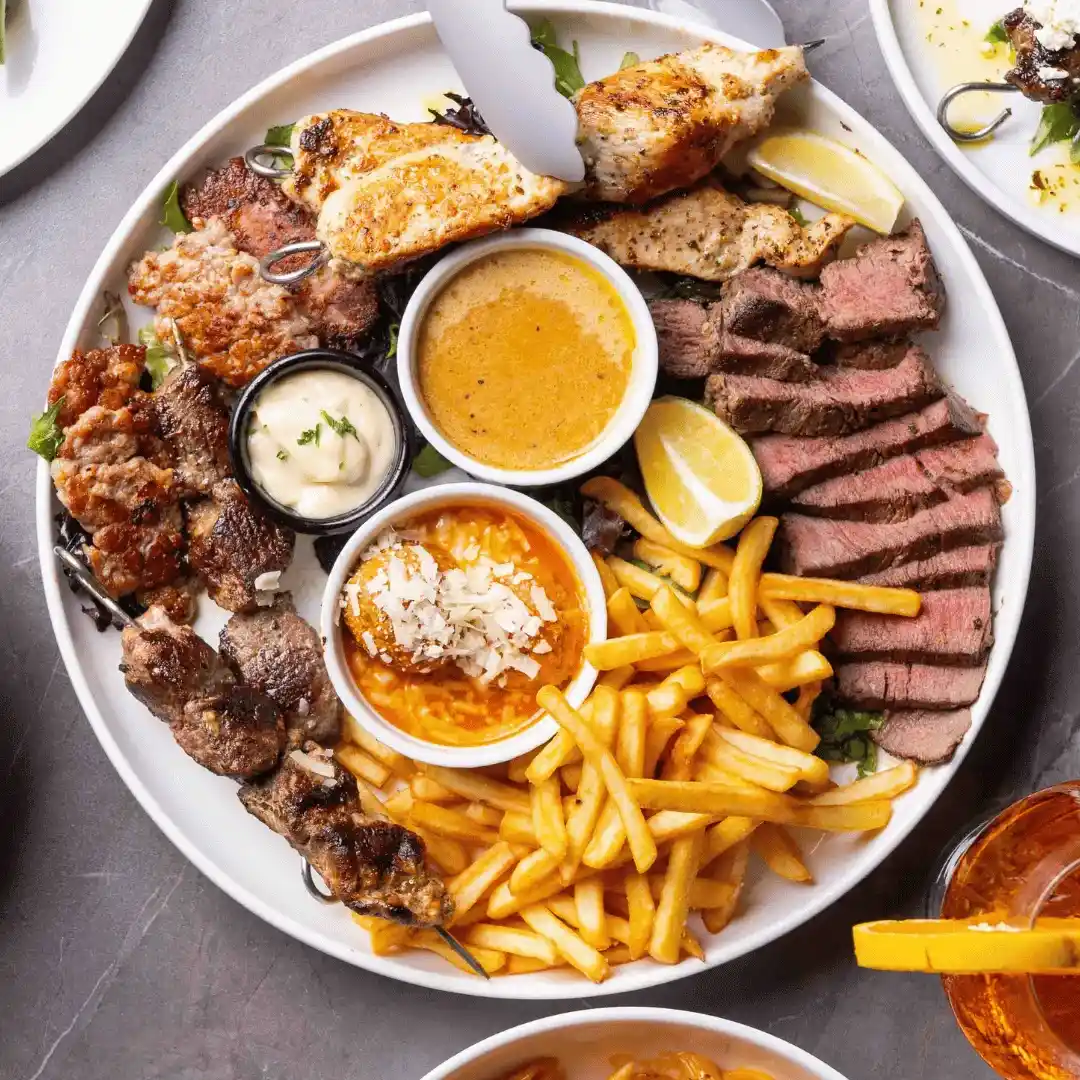 Mixed grill platter with fries at Enzo's Cucina Kogarah.